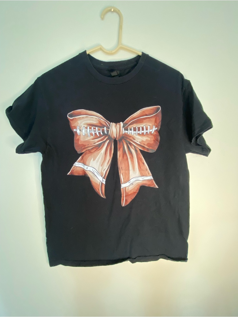 Gildan Black Tee with Orange Football Bow Graphic